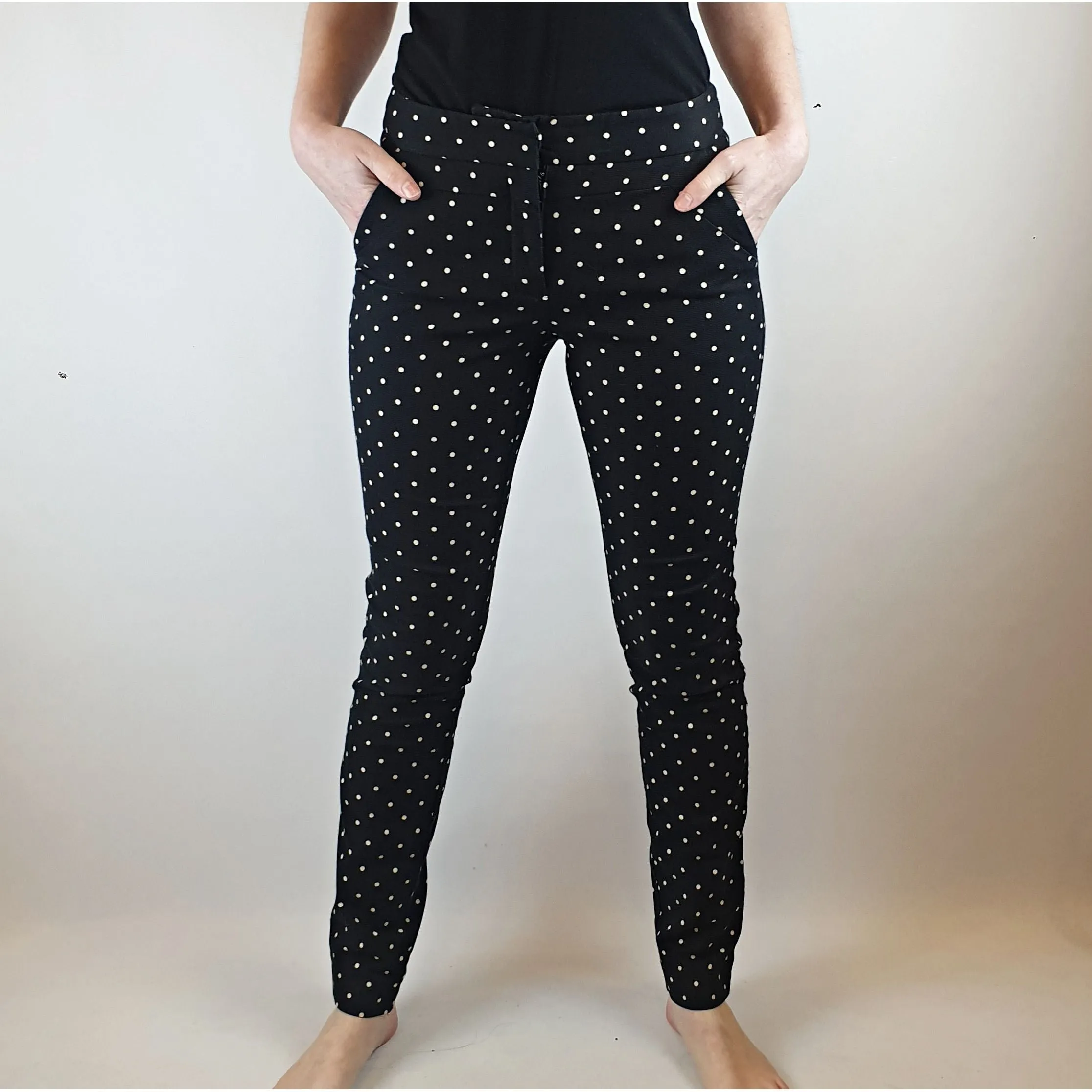 Cue black straight leg pants with white polka dots size 6