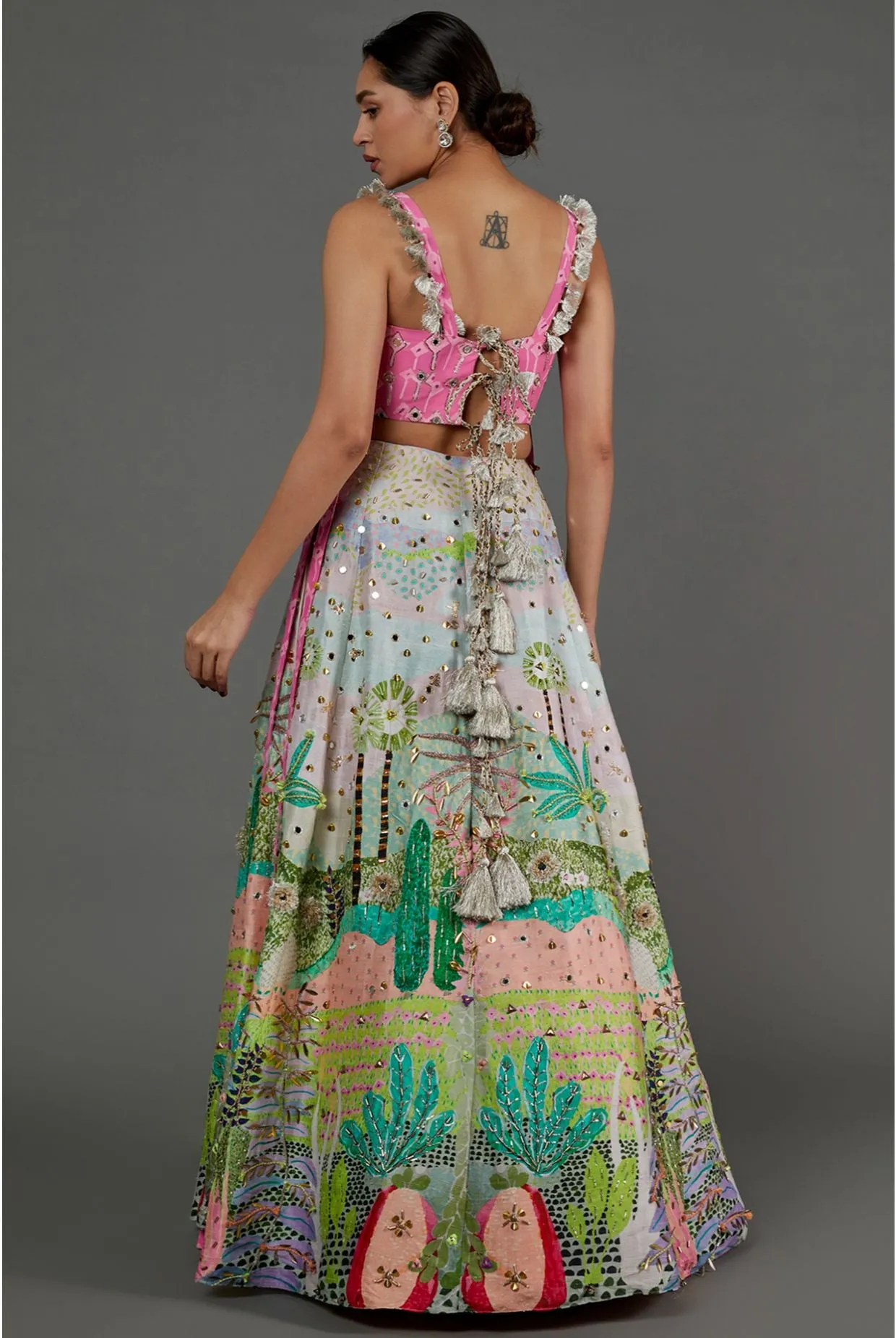 PINK KITE PRINT GEORGETTE EMBROIDERED BUSTIER AND TROPICAL PRINT DUPION SILK EMBROIDERED LEHENGA WITH PINK MUKAISH NET DUPATTA