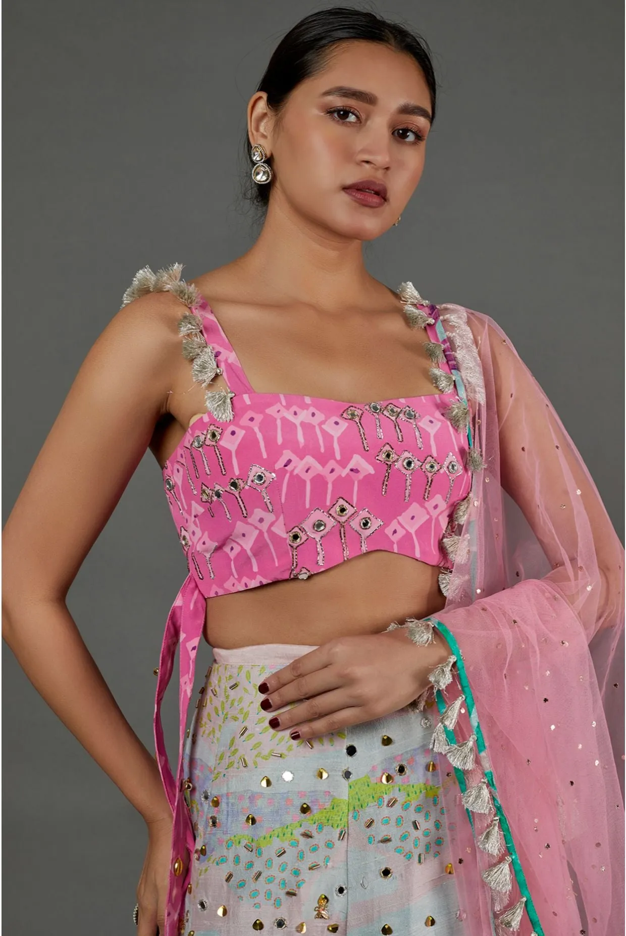 PINK KITE PRINT GEORGETTE EMBROIDERED BUSTIER AND TROPICAL PRINT DUPION SILK EMBROIDERED LEHENGA WITH PINK MUKAISH NET DUPATTA