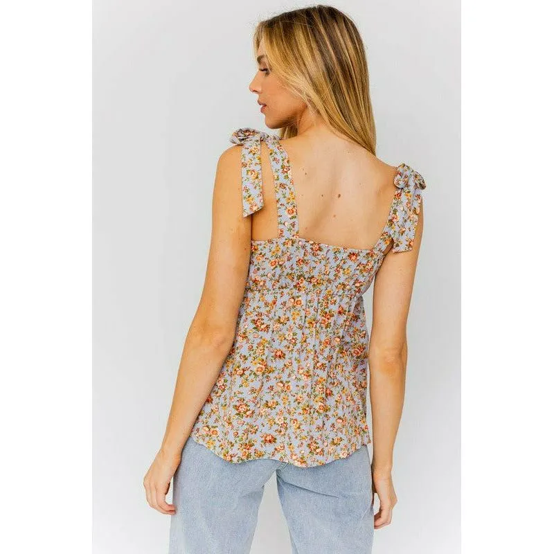 SLEEVELESS RUFFLE BOTTOM TOP