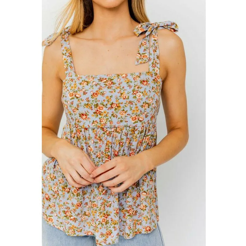 SLEEVELESS RUFFLE BOTTOM TOP