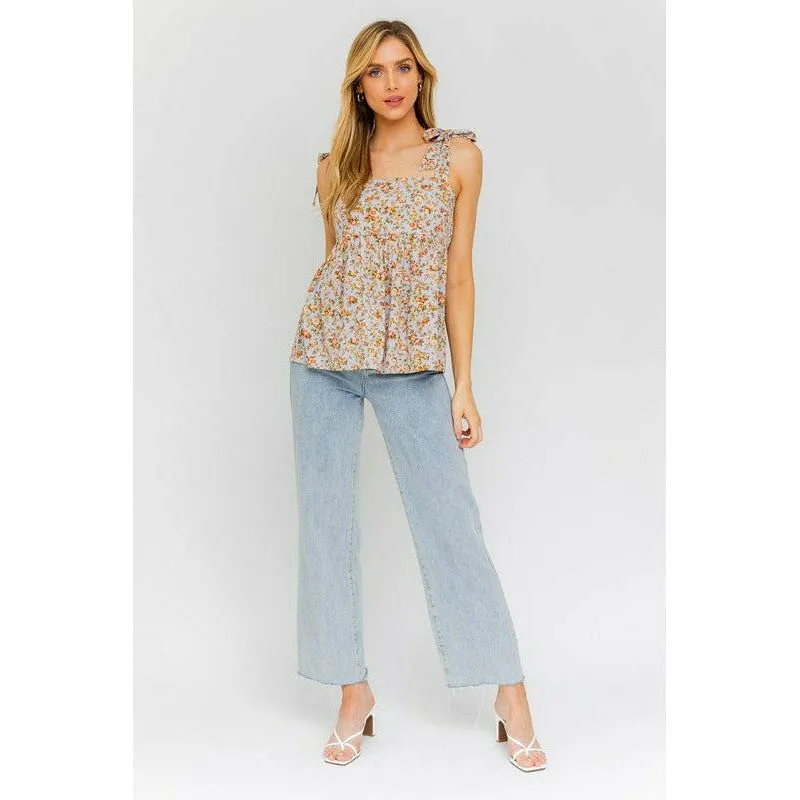SLEEVELESS RUFFLE BOTTOM TOP