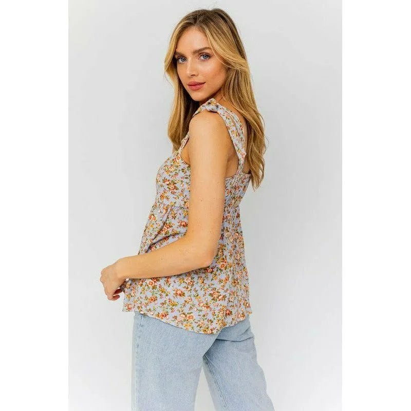 SLEEVELESS RUFFLE BOTTOM TOP